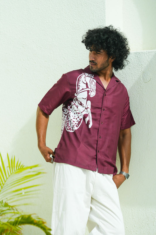 Emeey maroon oversized shirt with white horse graphic on male model